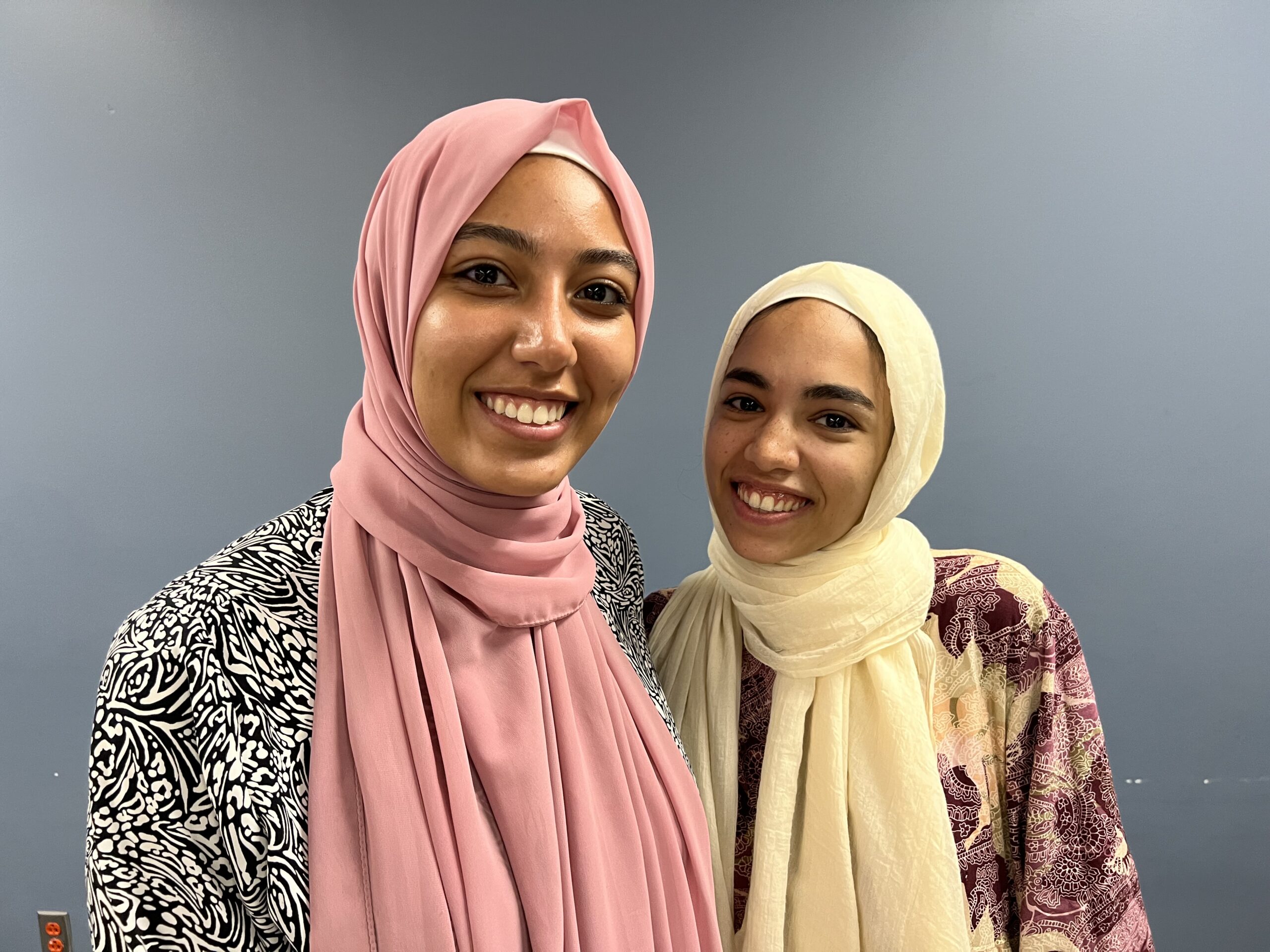 Two female exchange students from Egypt smile at camera